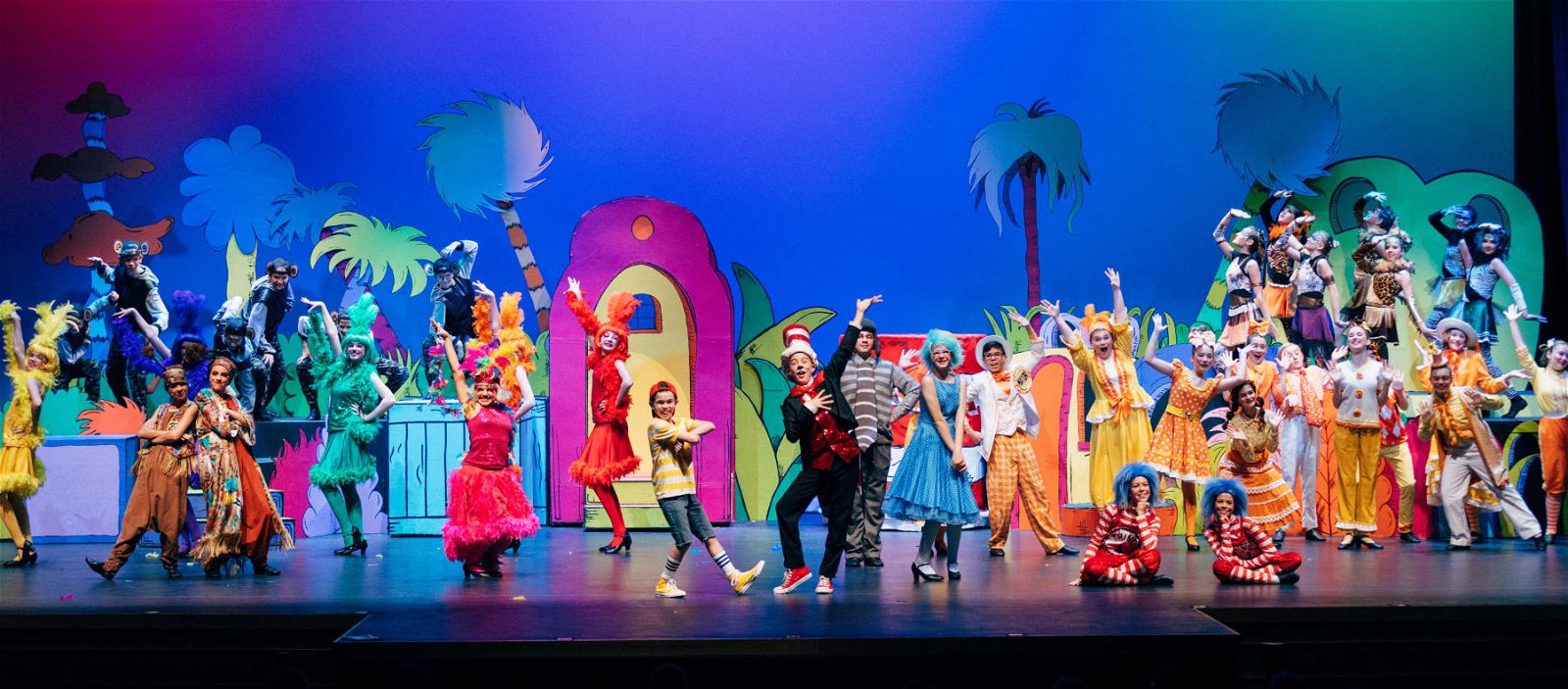 Cast of Seussical Jr posing on stage